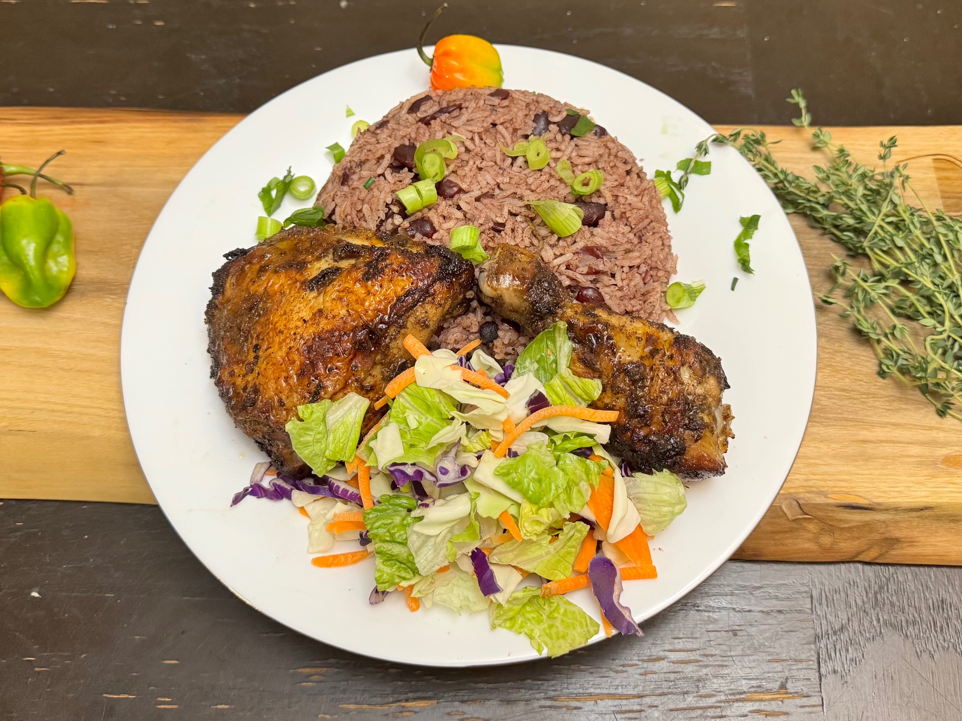 Jamaican jerk chicken with rice and peas